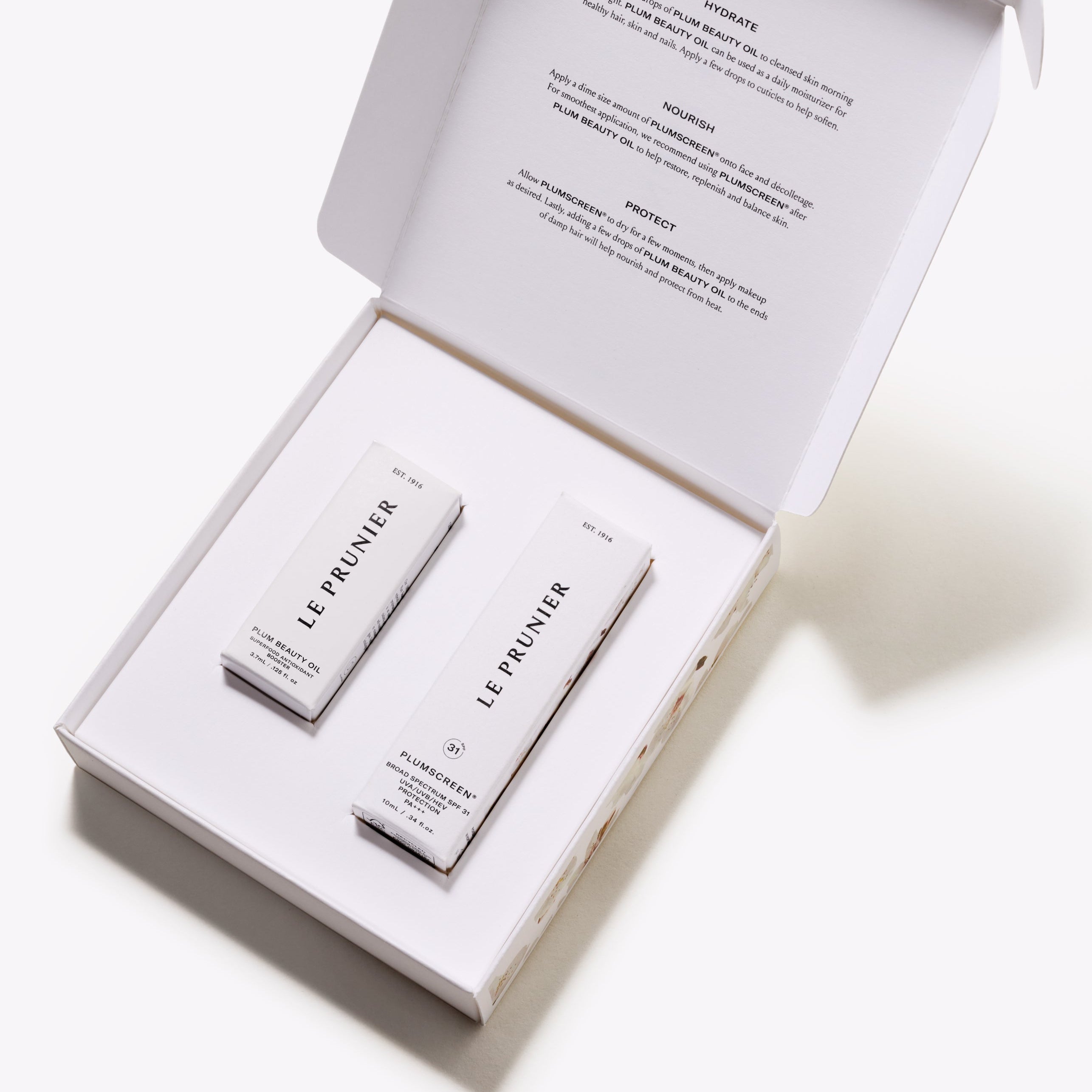 Petite Prunier Kit open box showing Plum Beauty Oil and Plumscreen minis with hydrate nourish protect ritual | Botā