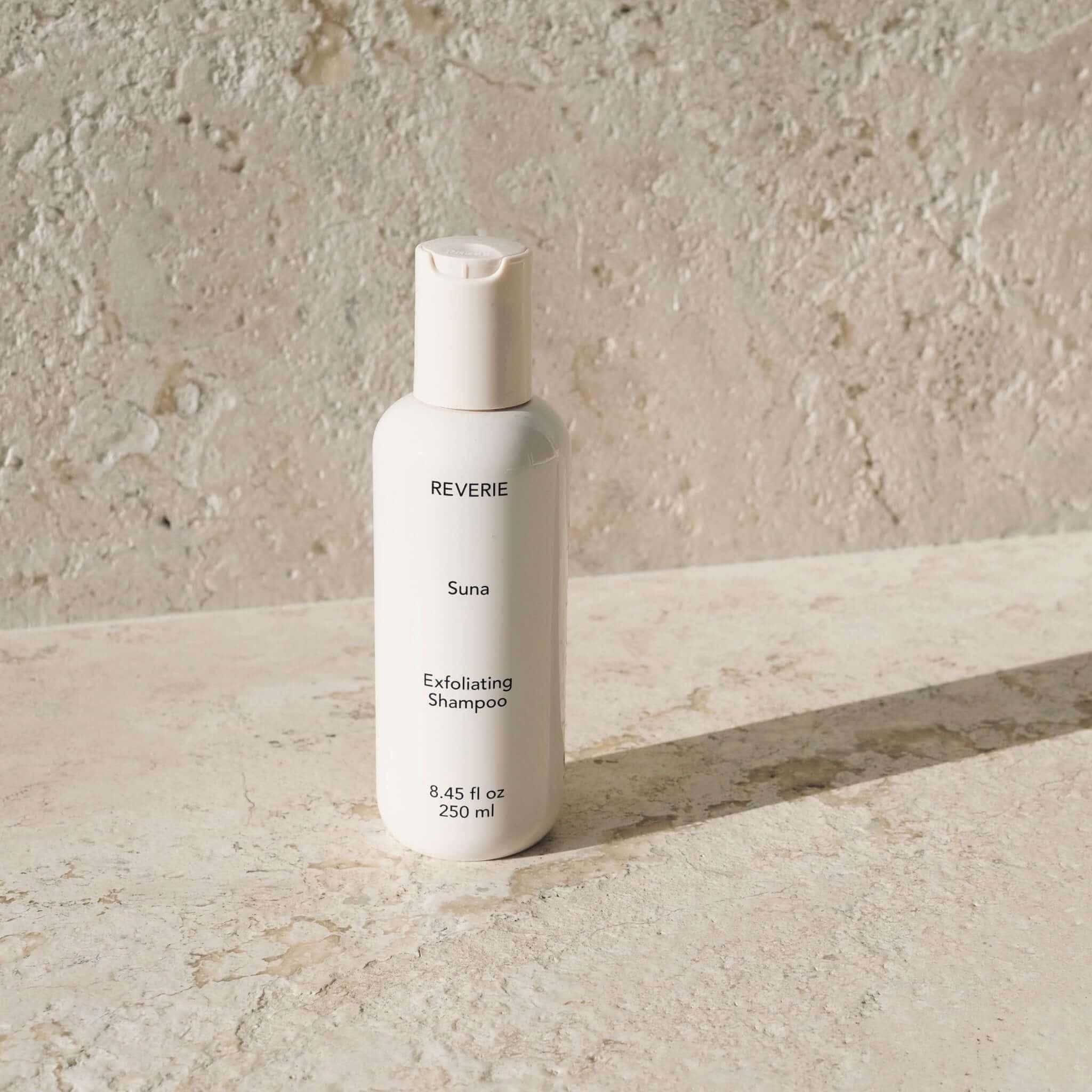 Reverie Suna Deep Exfoliating Shampoo — volcanic ash and charcoal scalp treatment bottle | Botā