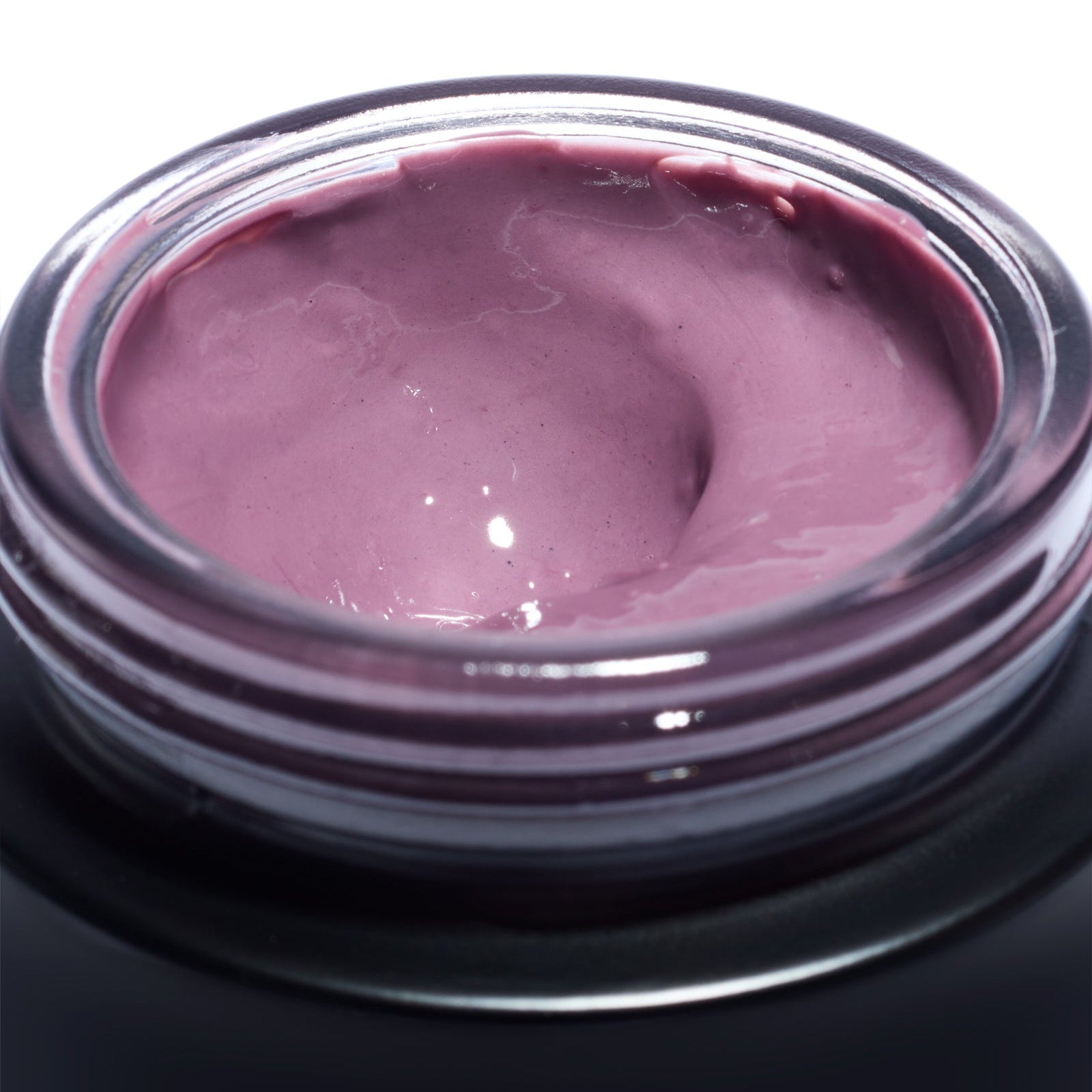 Close-up of the soft pink plum enzyme mask texture inside an open Le Prunier Plumtox jar | Botā natural skincare.