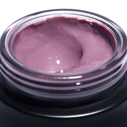 Close-up of the soft pink plum enzyme mask texture inside an open Le Prunier Plumtox jar | Botā natural skincare.