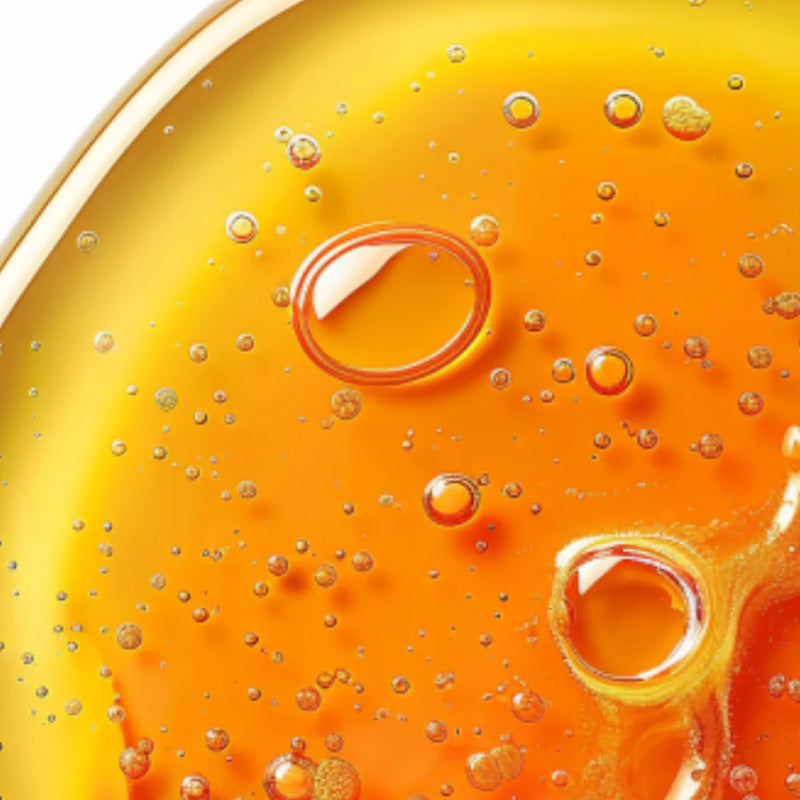 Close-up of golden oil with bubbles