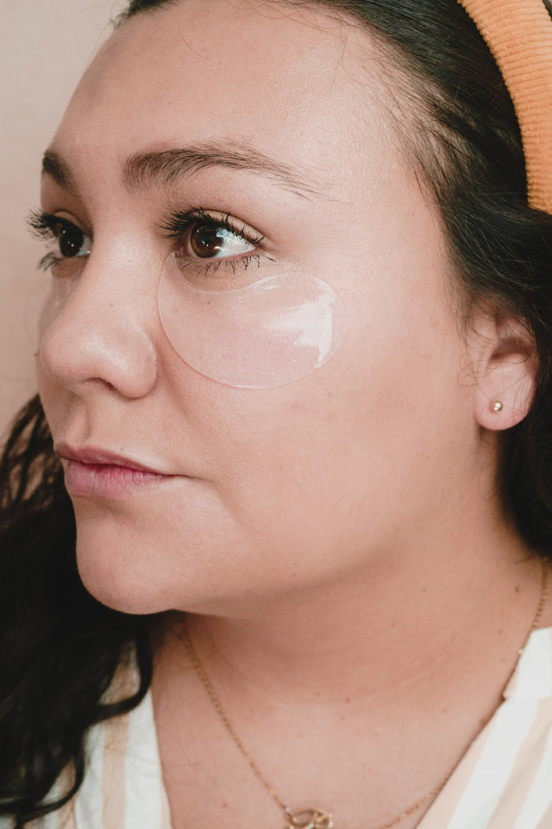 Hydrating under-eye patches applied to reduce puffiness and dark circles naturally