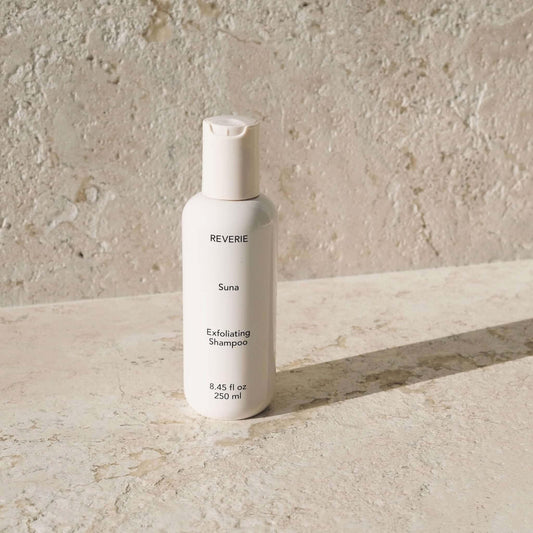 Reverie Suna Deep Exfoliating Shampoo — volcanic ash and charcoal scalp treatment bottle | Botā
