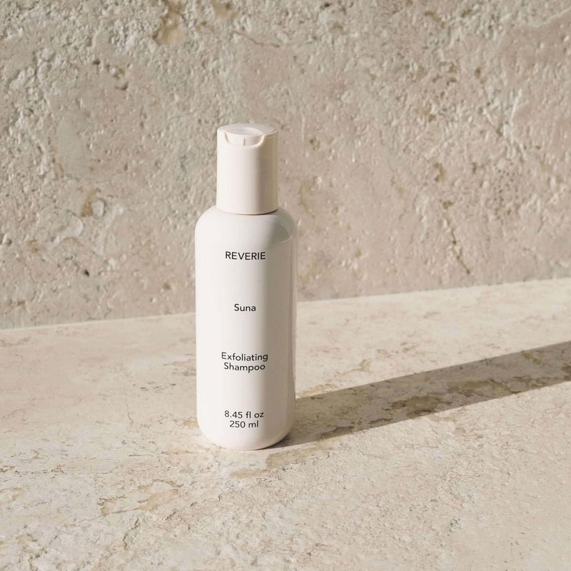 Reverie Suna Deep Exfoliating Shampoo — volcanic ash and charcoal scalp treatment bottle | Botā